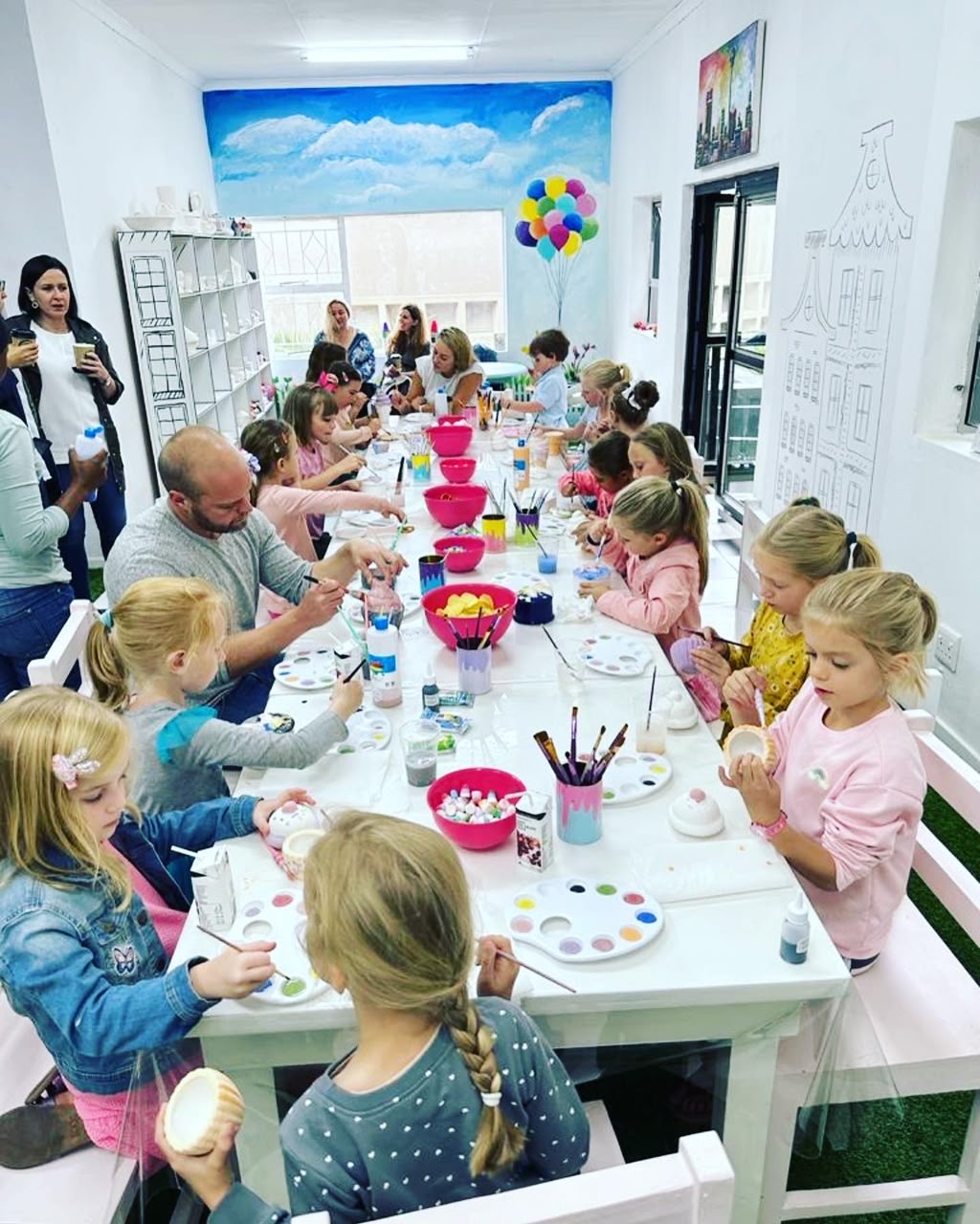 Kids party painting pottery together